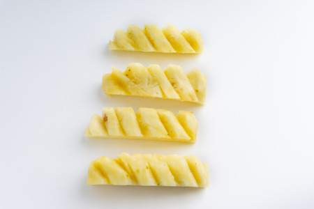 Pineapple with slices isolated on white background. Selective focus