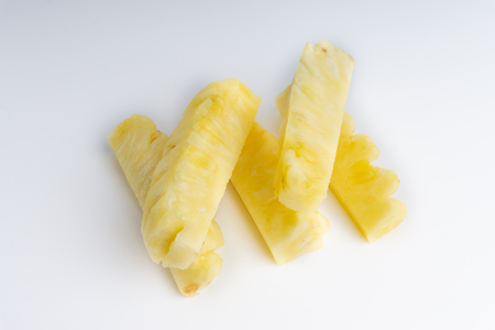 Pineapple with slices isolated on white background. Selective focusの写真素材