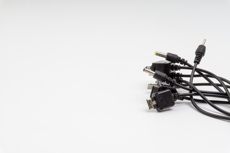 Universal recharger head isolated on white background. Selective focus and crop fragment