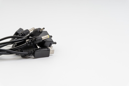 Universal recharger head isolated on white background. Selective focus and crop fragment