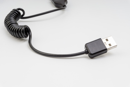 Universal recharger head isolated on white background. Selective focus and crop fragment