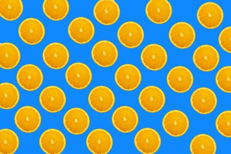 Slices orange on blue background. Background and pattern concept