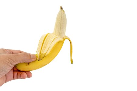 Hand holding Banana isolated on white backgroundの写真素材