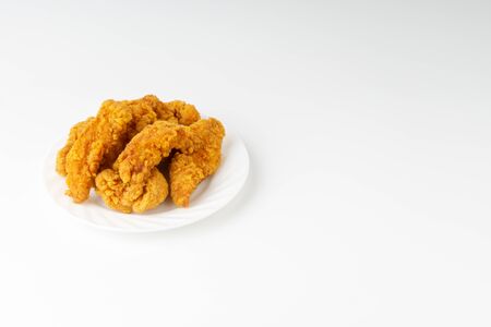 Fried breaded chicken fillet isolated on white backgroundの写真素材