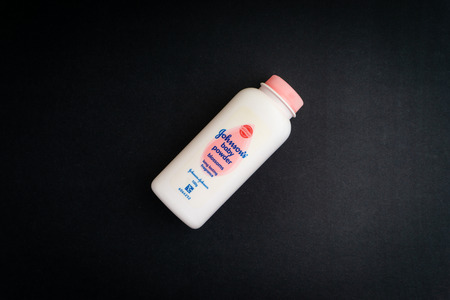 KUALA LUMPUR, MALAYSIA- November 9, 2019: Bottle of Johnson & Johnson baby powder on black background. Johnson & Johnson talc. Selective focusのeditorial素材