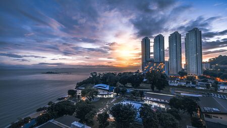 Penang, Malaysia, December 28, 2019 : Beautiful view hotels during sunrise, haze and bad weather in...