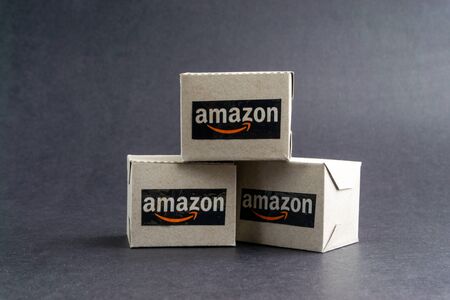 Kuala Lumpur, Malaysia - January 29, 2020 : Amazon shipping packages boxes on black background. Copy space and Online sales conceptのeditorial素材