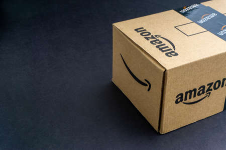 Kuala Lumpur, Malaysia - April 1, 2020 : Amazon Prime box or Amazon shipping box on black background. Crop fragment, business conceptのeditorial素材