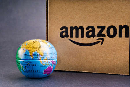 Kuala Lumpur, Malaysia - April 1, 2020 : Amazon Prime box or Amazon shipping box on black background. Crop fragment, business conceptのeditorial素材