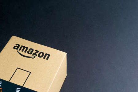 Kuala Lumpur, Malaysia - April 1, 2020 : Amazon Prime box or Amazon shipping box on black background. Crop fragment, business conceptのeditorial素材