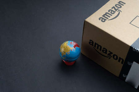 Kuala Lumpur, Malaysia - April 1, 2020 : Amazon Prime box or Amazon shipping box on black background. Crop fragment, business conceptのeditorial素材