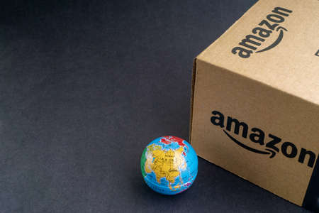 Kuala Lumpur, Malaysia - April 1, 2020 : Amazon Prime box or Amazon shipping box on black background. Crop fragment, business conceptのeditorial素材