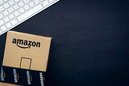 Kuala Lumpur, Malaysia - April 1, 2020 : Amazon Prime box or Amazon shipping box on black background. Crop fragment, business conceptのeditorial素材