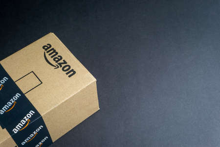 Kuala Lumpur, Malaysia - April 1, 2020 : Amazon Prime box or Amazon shipping box on black background. Crop fragment, business conceptのeditorial素材
