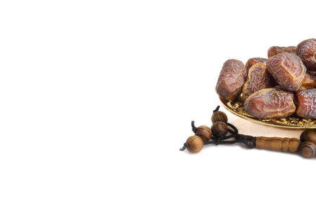 Date fruits or dry dates isolated on white background.Ramadan Kareem Breaking the fast by eating Tamar Datesの写真素材