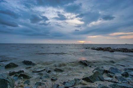 Peaceful beach view and waves during sunset at Jeram, Kuala Selangor Malaysiaの写真素材