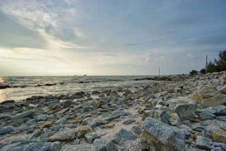 Peaceful beach view and waves during sunset at Jeram, Kuala Selangor Malaysiaの写真素材
