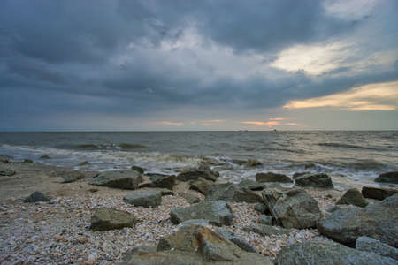 Peaceful beach view and waves during sunset at Jeram, Kuala Selangor Malaysiaの写真素材