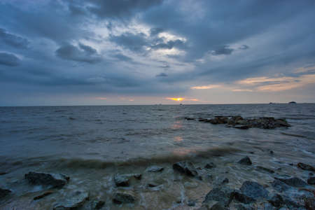 Peaceful beach view and waves during sunset at Jeram, Kuala Selangor Malaysiaの写真素材