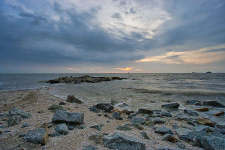 Peaceful beach view and waves during sunset at Jeram, Kuala Selangor Malaysiaの写真素材