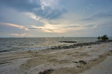 Peaceful beach view and waves during sunset at Jeram, Kuala Selangor Malaysiaの写真素材