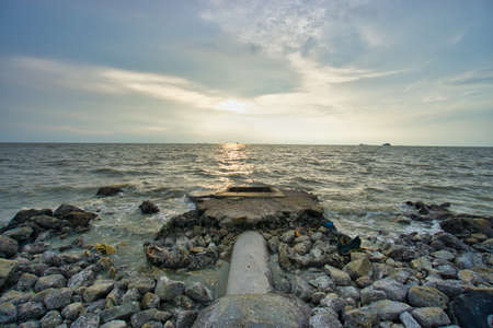 Peaceful beach view and waves during sunset at Jeram, Kuala Selangor Malaysiaの写真素材