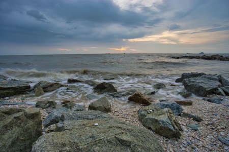 Peaceful beach view and waves during sunset at Jeram, Kuala Selangor Malaysiaの写真素材