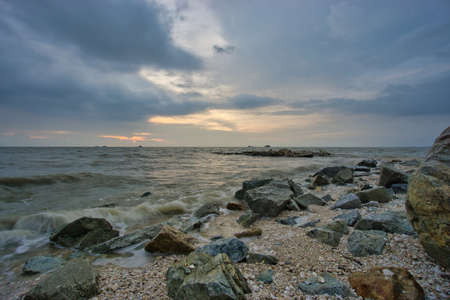 Peaceful beach view and waves during sunset at Jeram, Kuala Selangor Malaysiaの写真素材