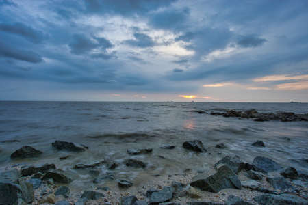 Peaceful beach view and waves during sunset at Jeram, Kuala Selangor Malaysiaの写真素材