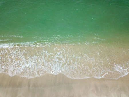 Blue ocean wave on clean sandy beach. Holidays and Travel Conceptの写真素材
