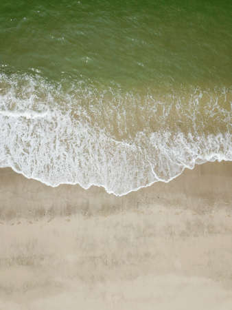 Blue ocean wave on clean sandy beach. Holidays and Travel Conceptの写真素材