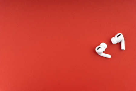 Kuala Lumpur, Malaysia - December 1,2020 : AirPods Pro on red backgroundのeditorial素材
