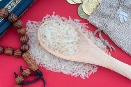 Holy Quran, Coins,Rosary and rice. Zakat concept. Zakat is a form of alm-giving as a religious obligationの写真素材