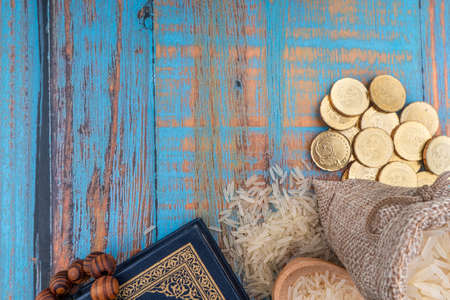 Holy Quran, Coins, Rosary and Rice. Zakat and Copy Space concept.の写真素材