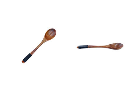 Wooden food spoon isolated on white background. Cutlery and Tableware.の写真素材