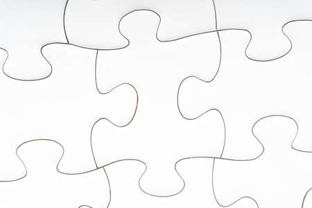 Red jigsaw puzzle pieces on red background. Copy space and business conceptの写真素材