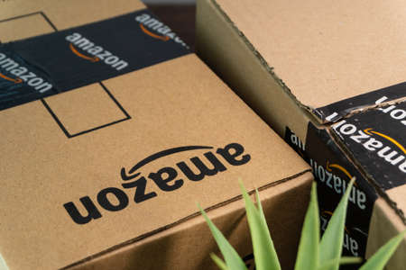 Kuala Lumpur, Malaysia - June 1, 2021 : Amazon Prime box or Amazon shipping box on black background. Crop fragment, business conceptのeditorial素材