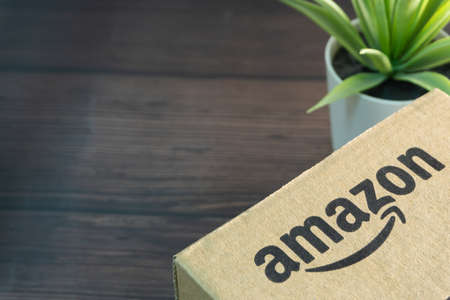 Kuala Lumpur, Malaysia - June 1, 2021 : Amazon Prime box or Amazon shipping box on black background. Crop fragment, business conceptのeditorial素材