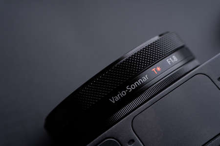 Kuala Lumpur, Malaysia - June 3,2021 : Sony compact or mirrorless camera closeup on black background. Selective focus and crop fragmentのeditorial素材