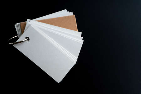 Blank ring memo on black backgroundの写真素材
