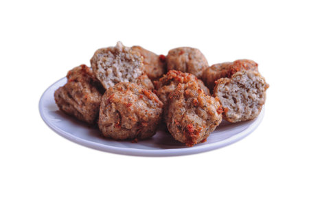 Chicken kofta meatballs mixed with ingredients of onions, garlic fresh herbs and spices mixture on white backgroundの写真素材
