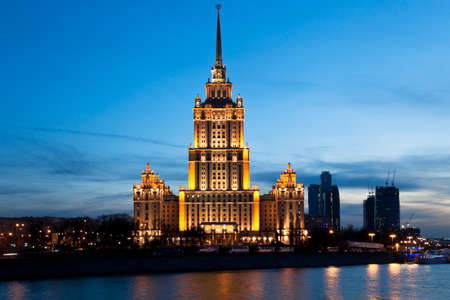 View of High-rise building across Moscow river at night, Moscow, Russiaのeditorial素材