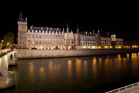 Castle Conciergerie and Seine river at night. Paris, France.のeditorial素材