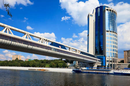 Pedestrian bridge Bagration over Moscow river and the International Business Centre, Moscow, Russiaのeditorial素材