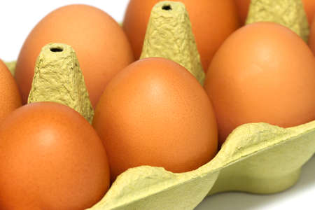 Fresh eggs in a carton, close-up.の写真素材