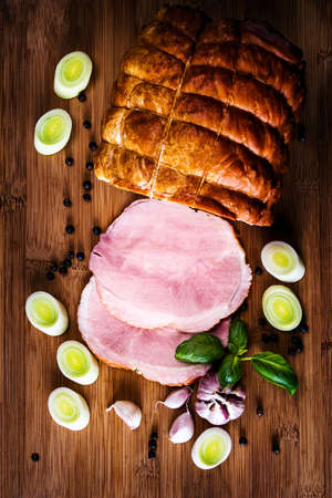 traditional smoked ham sliced ??on the boardの写真素材