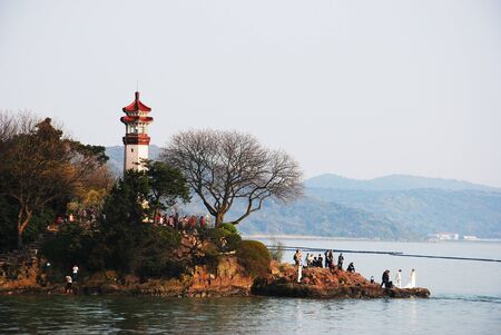 People standing by the lakeの写真素材