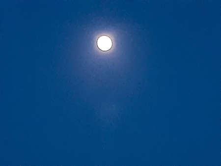 Moon and moonlight in the evening sky. This is a picture of a village environment.の写真素材