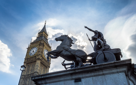 Big Ben, London, United Kingdom - A view of the popular landmark with the statue of Boadicea, the clock tower known as Big Ben against a blue and cloudy sky.のeditorial素材