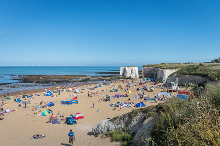 Botany Bay, Kent, United Kingdom - August 14, 2016 : Sunny weather brought tourists and visitors to Botany Bay Beach near Broadstairs Kent to enjoy the beach waves and summer sunshine.のeditorial素材